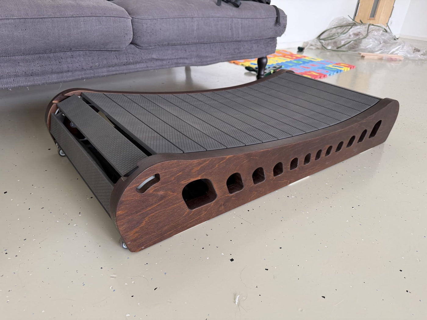 The Office Walker tucked under a standing desk at home